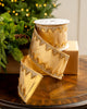 Gold ribbon with elegant, embroidered trim on a Christmas background