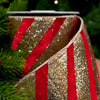 Decorative ribbon with red and gold stripes on a blurred green background