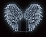 Decorative angel wings with LED lights on a black background