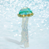 Decorative jellyfish ornament with a glittery texture on a light blue background