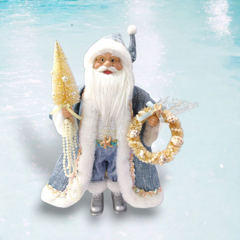 Decorative figure of a winter-themed Santa Claus holding a wreath and a tree against a snowy background.