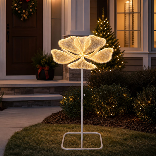 Decorative outdoor light shaped like a flower on a stand in front of a house with Christmas decorations.
