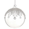 Clear Christmas ball ornament with silver embellishments on a white background