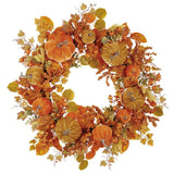Autumn leaf wreath with orange berries on a white background