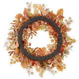 The back view of an autumn leaf wreath with pinecones on a white background