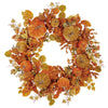 Autumn leaf wreath with orange berries on a white background