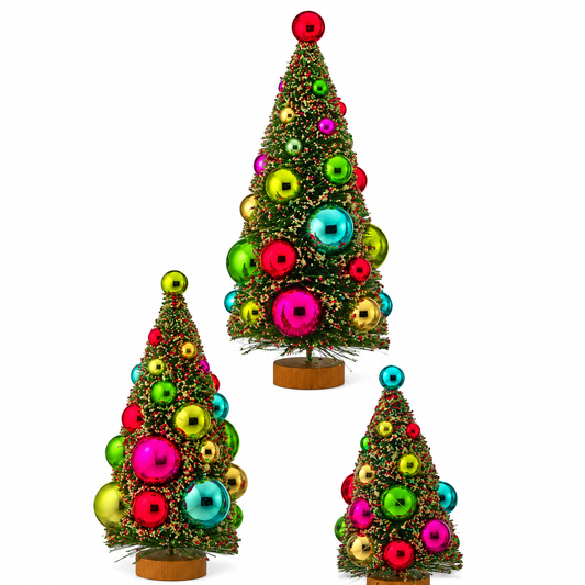 Three small Christmas trees with colorful ornaments on a white background