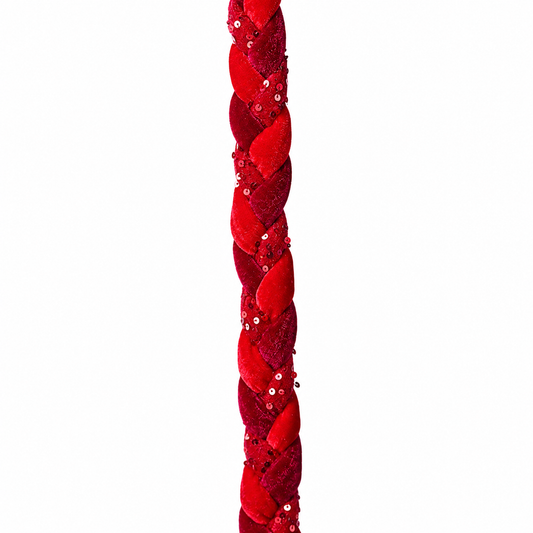 Red braided decorative garland with sequins on a white background