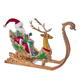 Decorative model of Santa Claus in a sleigh pulled by a reindeer on a white background