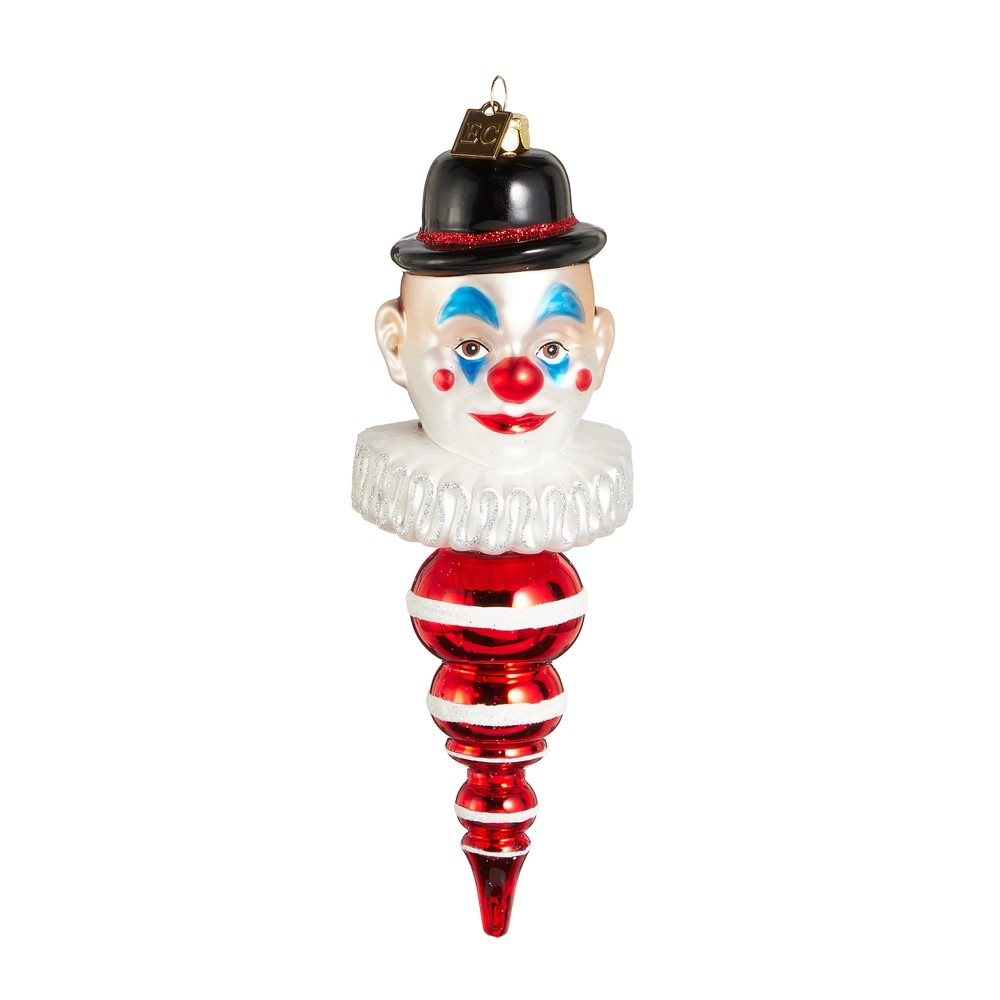 Glass ornament shaped like a clown face with a black top hat on a white background