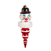Glass ornament shaped like a clown face with a black top hat on a white background