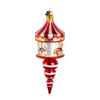 Decorative Christmas ornament resembling a miniature carousel on a white background