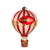 Decorative hot air balloon ornament with red and white stripes and 'Carnival' text on a white background