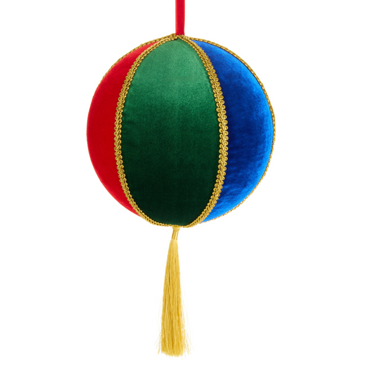 Decorative ornament with red, green, and blue sections and a yellow tassel on a white background