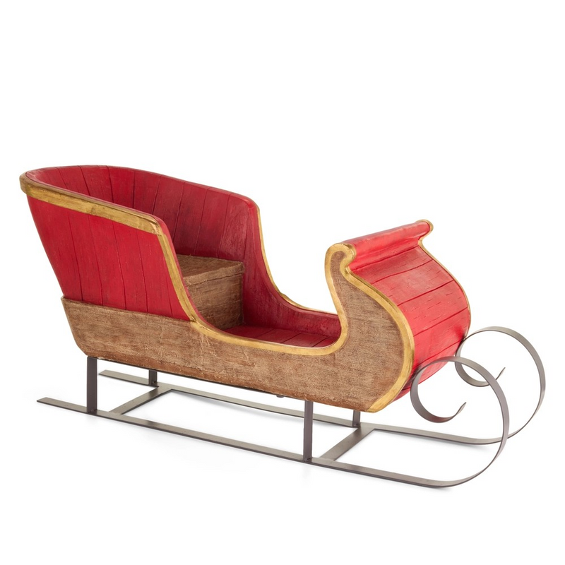 Red and brown wooden sleigh on a white background