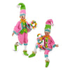 Two colorful elf dolls with green hats and pink outfits on a white background