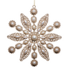 Decorative snowflake ornament with pearls on a white background