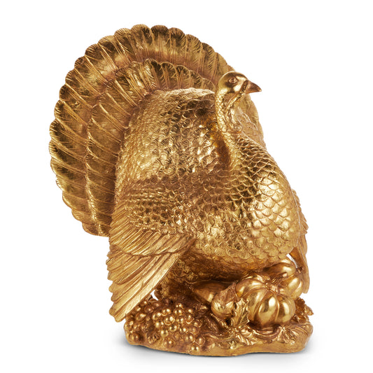 Gold turkey figurine on a white background