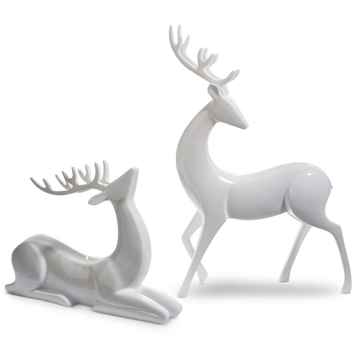 Two white ceramic deer figurines on a white background