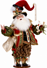 Decorative figure of a festive character with a red hat and white beard, holding a bag and a staff.