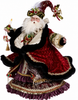 Luxurious crimson velvet Santa with jeweled holiday slendor.