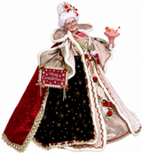 Decorative figure of a woman in festive attire with a 'Merry Christmas' sign, holding a pink cake.