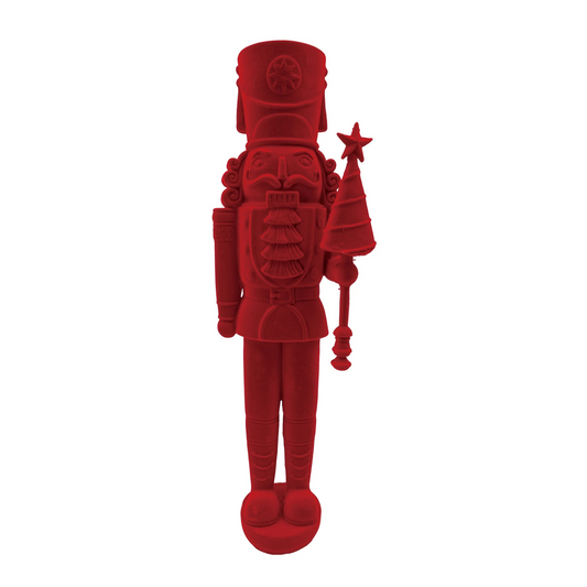Red toy soldier figurine on a white background