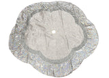 Silver glittery tree skirt on a white background