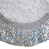 Close-up of a decorative fabric with intricate patterns and sequins.