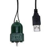 Green electronic component with USB connector on a white background