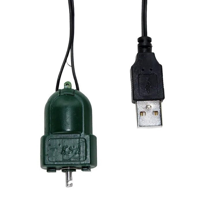 Green electronic component with USB connector on a white background