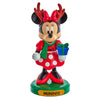 Minnie Mouse figurine with reindeer antlers and a gift, on a white background
