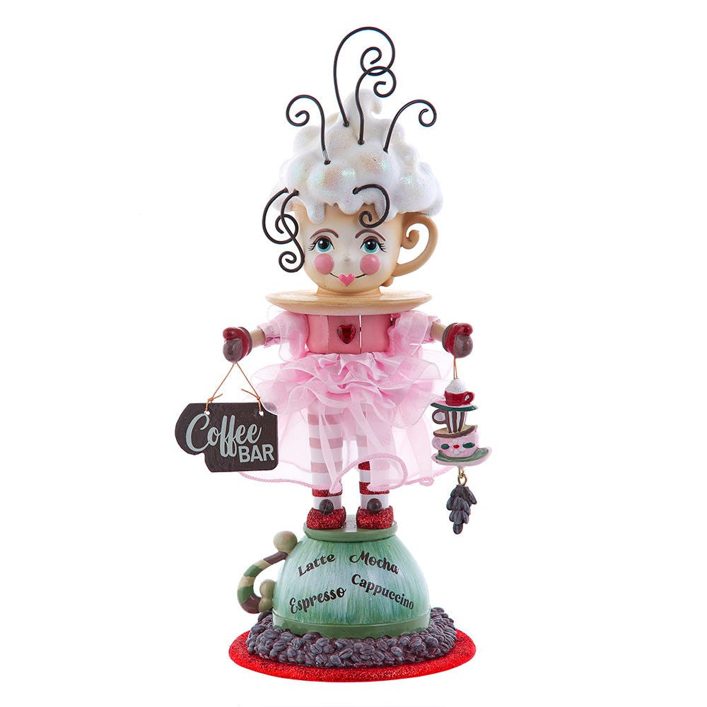 Decorative figurine of a character in a coffee-themed outfit with a 'Coffee Bar' sign.