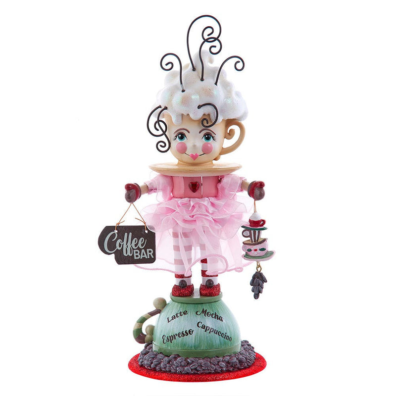 Decorative figurine of a character in a coffee-themed outfit with a 'Coffee Bar' sign.