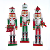 Three decorative nutcrackers with Christmas-themed outfits on a white background