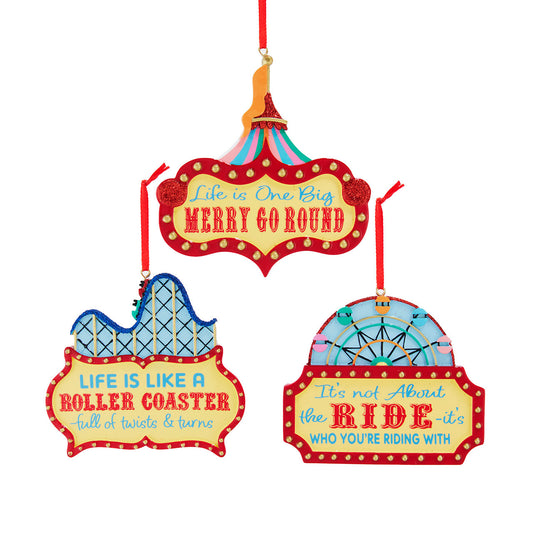 Three colorful carnival-themed signs with motivational quotes on a white background.