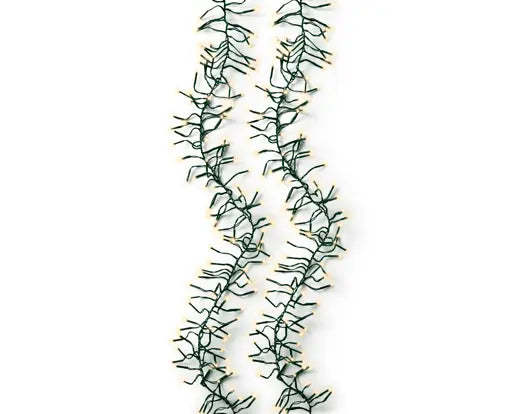 Decorative green garland with lights on a white background