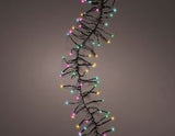 Decorative string of multi color lights on a plain background
