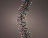 Decorative string of multi color lights on a plain background