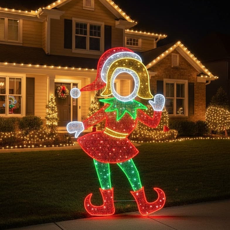 Decorative lighted elf figure in front of a house with Christmas lights.