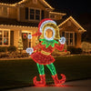 Decorative lighted elf figure in front of a house with Christmas lights.