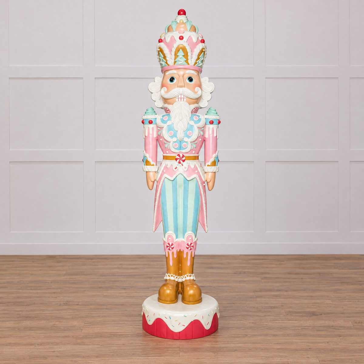 Decorative nutcracker figurine with pastel colors on a white background