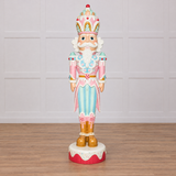 Decorative nutcracker figurine with pastel colors on a white background