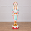 Decorative nutcracker figurine with pastel colors on a white background