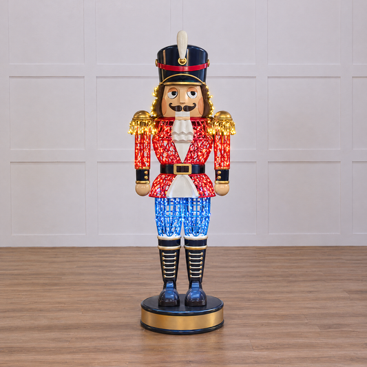 Decorative nutcracker figure with LED lights on a black background