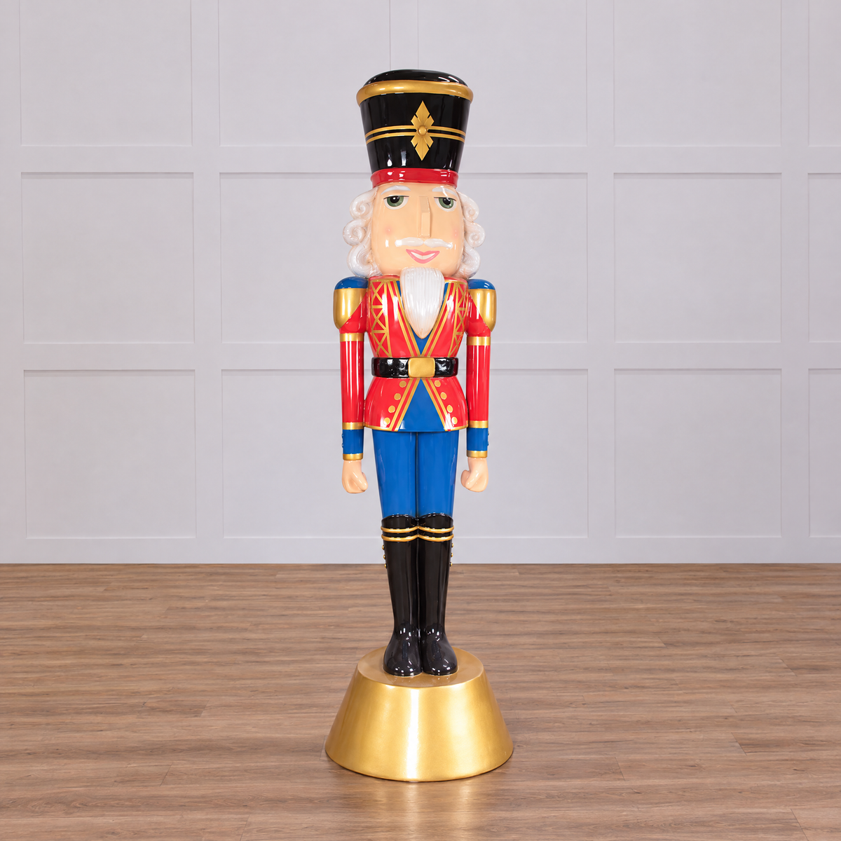 A 9 foot tall nutcracker in red and blue uniform with a golden base and hat.