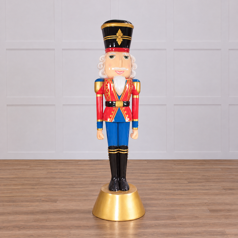 A 9 foot tall nutcracker in red and blue uniform with a golden base and hat.