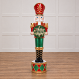 Decorative Christmas nutcracker with 'Merry Christmas' text on a white background
