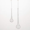 Silver teardrop earrings on a white background