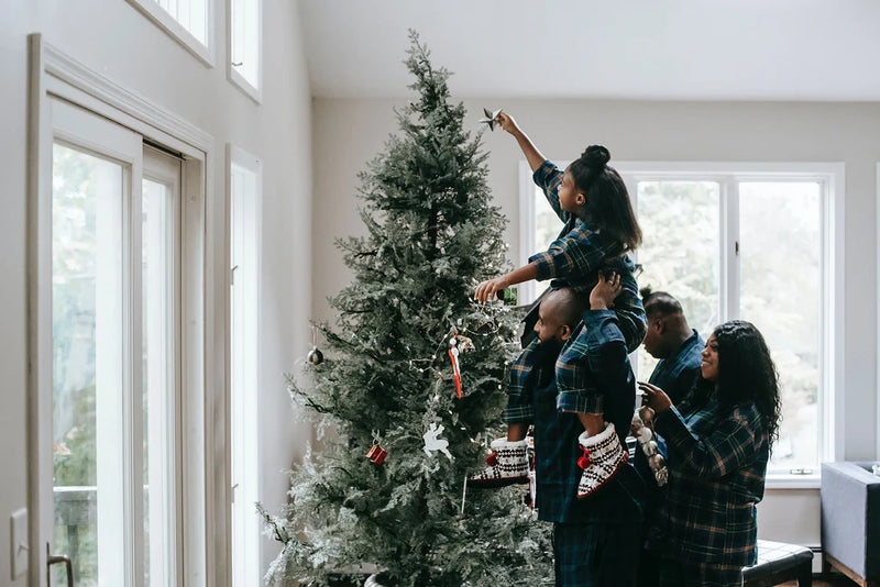 Family by the Christmas tree
